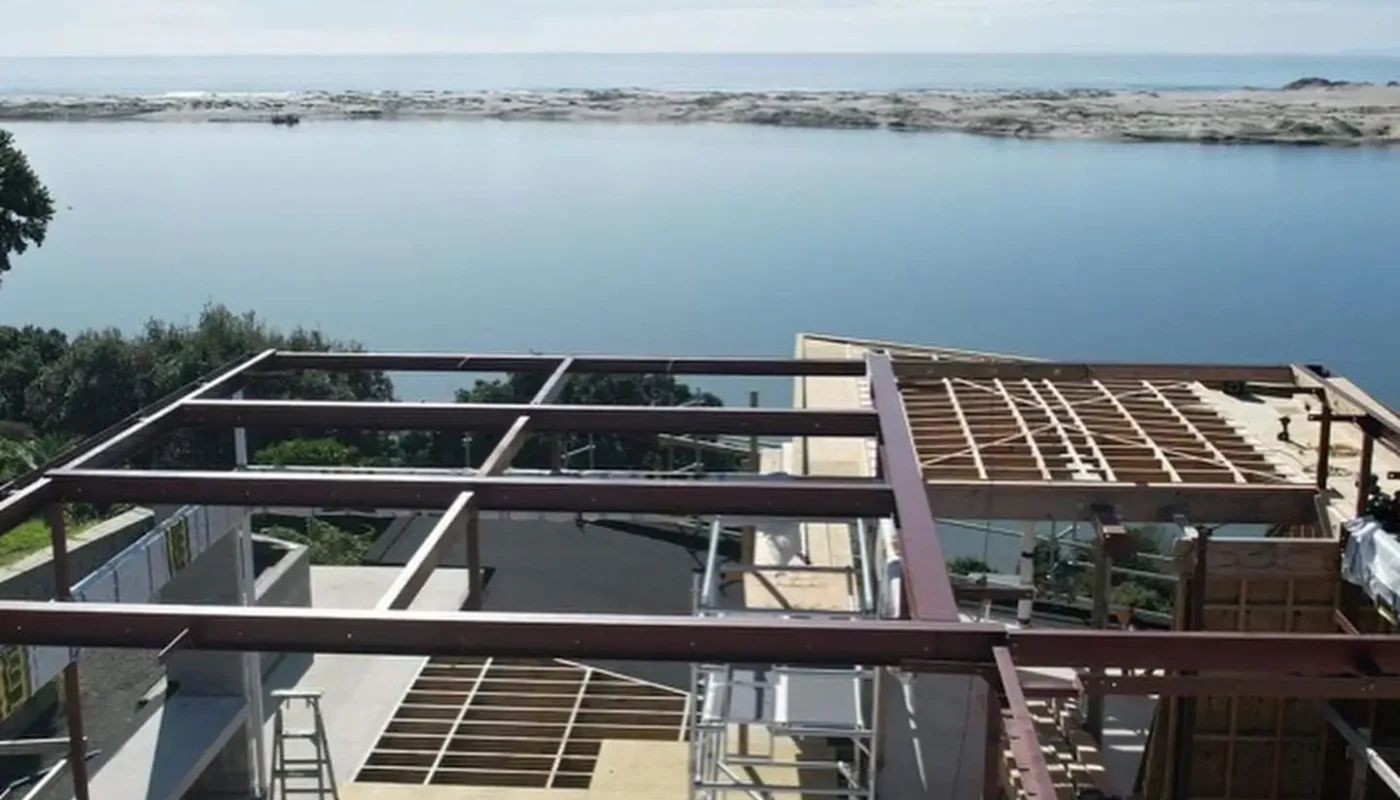 Waterfront deck construction with steel frames by Brock Cooley Builders.