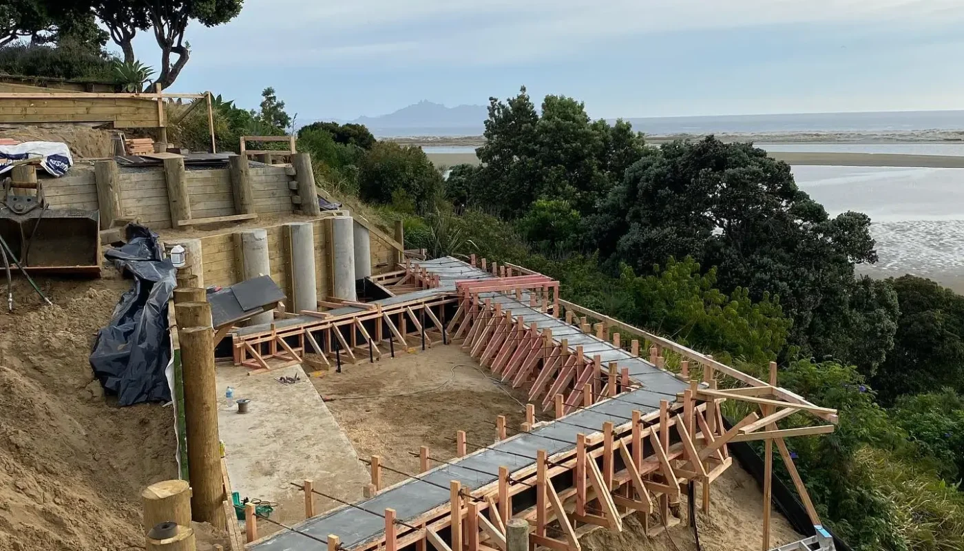 Coastal Construction with Retaining Structures by Brock Cooley Builders. Coastal construction site with concrete retaining structures by Brock Cooley Builders.